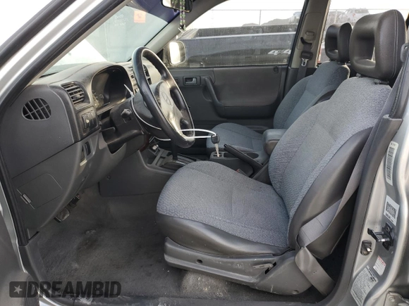 1999 Isuzu Rodeo S with VIN 4S2CK58W2X4361475, listed as a Copart auction lot 63873864 with 232,406 mi miles and Salvage Title. Bid and sale history available at DreamBid. Image 7.