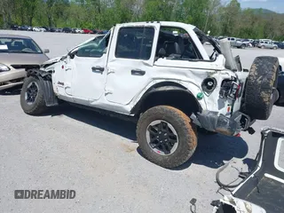 2020 Jeep Wrangler Unlimited Rubicon z VIN 1C4JJXFM5LW278740, wystawiony jako IAAI lot #42086112 z przebiegiem 93 658 mil mil oraz . Historia ofert i sprzedaży dostępna na DreamBid. Obrazek 3.