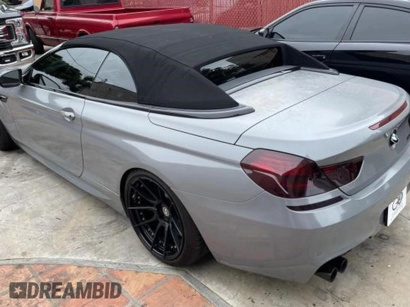 2016 BMW M6 z VIN WBS6G9C54GD932196, wystawiony jako Copart lot #53960063 z przebiegiem 46 162 mil mil oraz . Historia ofert i sprzedaży dostępna na DreamBid. Obrazek 3.