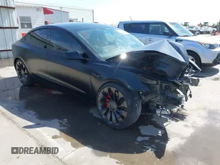 2022 Tesla Model 3 Performance with VIN 5YJ3E1EC6NF104475, listed as a IAAI auction lot 41734724 with 31,717 mi miles. Bid and sale history available at carsss.com. Image 1.