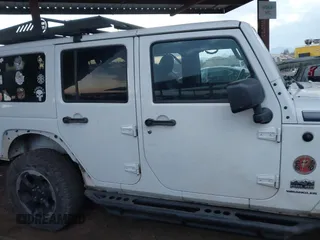 2014 Jeep Wrangler Unlimited Sahara with VIN 1C4BJWEG7EL204489, listed as a IAAI auction lot 41255239 with 68,803 mi miles and . Bid and sale history available at DreamBid. Image 13.