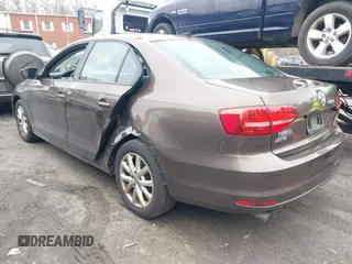 2015 Volkswagen Jetta Sedan 1.8T SE with VIN 3VWD17AJ2FM403107, listed as a IAAI auction lot 41849921 with 103,990 mi miles. Bid and sale history available at carsss.com. Image 3.