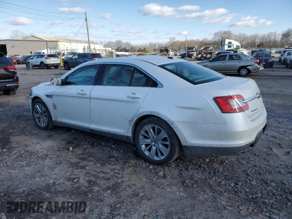 2012 Ford Taurus Limited with VIN 1FAHP2JW1CG137088, listed as a Copart auction lot 88427755 with 92,888 mi miles and Salvage title. Bid and sale history available at DreamBid. Image 2.