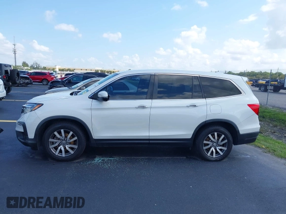 2020 Honda Pilot EX-L with VIN 5FNYF5H59LB028268, listed as a IAAI auction lot 42355620 with 107,033 mi miles and . Bid and sale history available at DreamBid. Image 14.