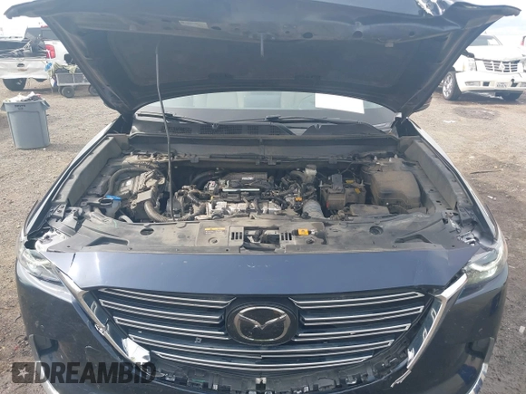 2020 Mazda CX-9 Grand Touring with VIN JM3TCBDY1L0402718, listed as a IAAI auction lot 42355511 with 87,205 mi miles and . Bid and sale history available at DreamBid. Image 10.