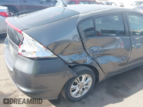 2010 Honda Insight EX with VIN JHMZE2H71AS032532, listed as a IAAI auction lot 41988221 with 333,144 mi miles and . Bid and sale history available at DreamBid. Image 6.
