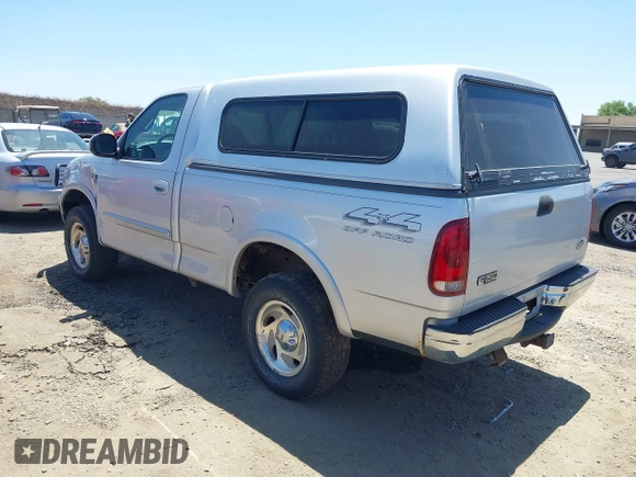 2000 Ford F-150 XL z VIN 1FTRF18L1YKA63179, wystawiony jako IAAI lot #42532771 z przebiegiem 116 604 mil mil oraz . Historia ofert i sprzedaży dostępna na DreamBid. Obrazek 3.