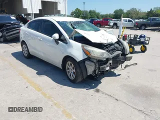 2013 Kia Rio LX with VIN KNADM4A3XD6272898, listed as a IAAI auction lot 42016753 with 165,635 mi miles. Bid and sale history available at carsss.com. Image 1.