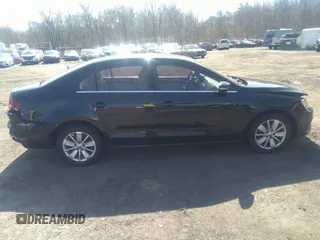 2016 Volkswagen Jetta Sedan 1.4T SE with VIN 3VWD67AJXGM242539, listed as a IAAI auction lot 38948493 with 121,876 mi miles. Bid and sale history available at carsss.com. Image 13.