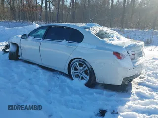 2014 BMW 7 Series 740Li xDrive with VIN WBAYF4C57ED282182, listed as a IAAI auction lot 41324877 with 102,699 mi miles. Bid and sale history available at carsss.com. Image 3.