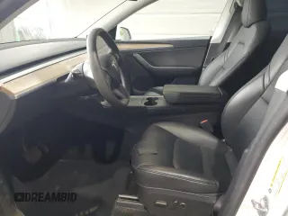 2024 Tesla Model Y Long Range с VIN 7SAYGDEE8RA266519, выставлен на аукционе Copart как лот 60899095 с пробегом Не указан миль и Списание • Salvage title. История ставок и продаж доступна на DreamBid. Изображение 7.