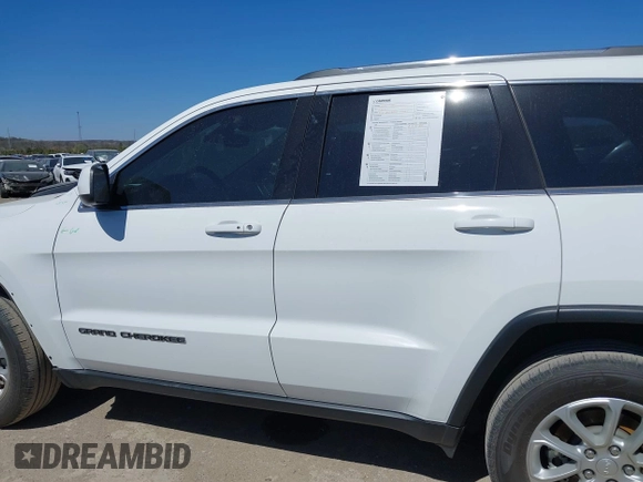 2021 Jeep Grand Cherokee Laredo E with VIN 1C4RJFAG5MC579865, listed as a IAAI auction lot 41818874 with 105,489 mi miles and . Bid and sale history available at DreamBid. Image 14.