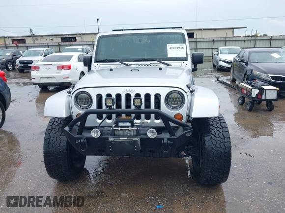 2012 Jeep Wrangler Unlimited Call of Duty MW3 with VIN 1C4BJWFG7CL281844, listed as a IAAI auction lot 42494946 with 93,669 mi miles and . Bid and sale history available at DreamBid. Image 12.