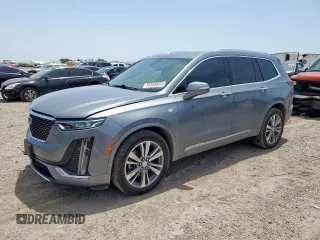 2021 Cadillac XT6 Premium Luxury with VIN 1GYKPFRSXMZ194706, listed as a Copart auction lot 56858655 with 73,756 mi miles and Salvage title. Bid and sale history available at DreamBid. Image 1.