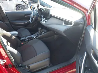2023 Toyota Corolla Hybrid LE with VIN JTDBCMFE2PJ008826, listed as a IAAI auction lot 41428742 with 21,256 mi miles. Bid and sale history available at carsss.com. Image 5.