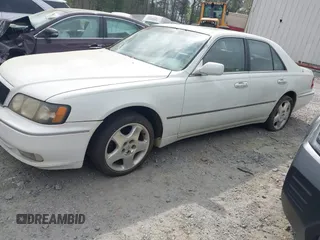 2000 Infiniti Q45 with VIN JNKBY31A9YM300780, listed as a IAAI auction lot 41950554 with 258,854 mi miles and . Bid and sale history available at DreamBid. Image 2.
