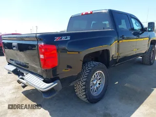 2015 Chevrolet Silverado 1500 LT with VIN 3GCUKRECXFG370962, listed as a IAAI auction lot 42141566 with 92,292 mi miles and . Bid and sale history available at DreamBid. Image 4.