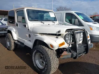2002 Jeep Wrangler Sahara with VIN 1J4FA59S02P760345, listed as a IAAI auction lot 41634902 with 123,506 mi miles. Bid and sale history available at carsss.com. Image 1.