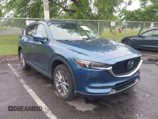 2019 Mazda CX-5 Grand Touring with VIN JM3KFADM9K1551347, listed as a IAAI auction lot 42520359 with 92,625 mi miles and . Bid and sale history available at DreamBid. Image 1.