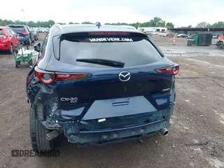2022 Mazda CX-30 S Premium with VIN 3MVDMBDL0NM413545, listed as a IAAI auction lot 42493594 with 57,013 mi miles and . Bid and sale history available at DreamBid. Image 17.