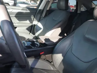 2016 Ford Fusion Titanium Hybrid with VIN 3FA6P0RU1GR259947, listed as a IAAI auction lot 41695377 with 97,605 mi miles. Bid and sale history available at carsss.com. Image 19.