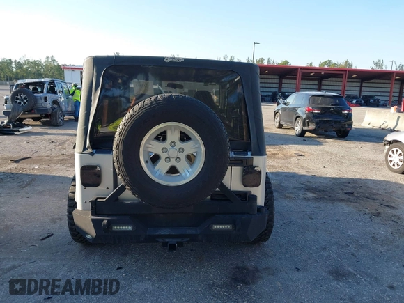 2005 Jeep Wrangler Unlimited with VIN 1J4FA44S65P335444, listed as a IAAI auction lot 41731093 with 143,918 mi miles. Bid and sale history available at carsss.com. Image 16.