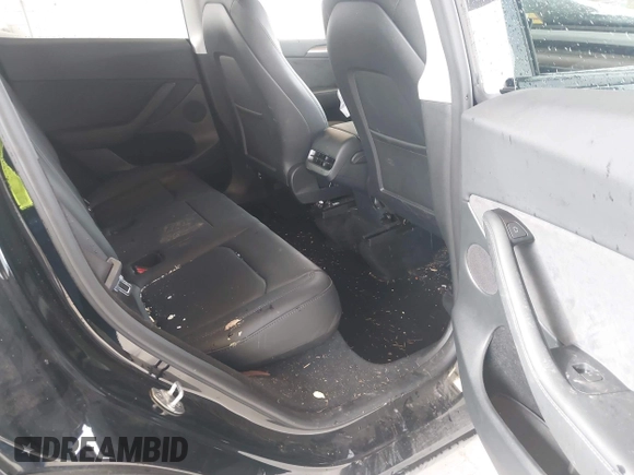 2023 Tesla Model Y Long Range with VIN 7SAYGDEE0PF909610, listed as a IAAI auction lot 41906081 with 20,656 mi miles and . Bid and sale history available at DreamBid. Image 8.