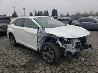 2020 Lexus RX 350L with VIN JTJHZKEA6L2014576, listed as a Copart auction lot 82706154 with 59,775 mi miles and Salvage title. Bid and sale history available at DreamBid. Image 4.