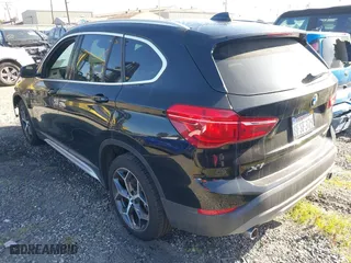 2018 BMW X1 sDrive28i with VIN WBXHU7C39J5L07129, listed as a IAAI auction lot 41472014 with 56,486 mi miles. Bid and sale history available at carsss.com. Image 3.