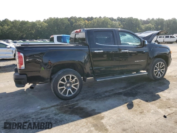 2021 GMC Canyon 2WD Denali with VIN 1GTG5EEN3M1192709, listed as a Copart auction lot 73865224 with 90,575 mi miles and Salvage Title. Bid and sale history available at carsss.com. Image 3.