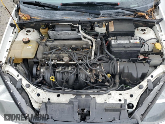 2004 Ford Focus with VIN 3FAFP37Z94R101447, listed as a Copart auction lot 74570054 with 162,166 mi miles and Salvage title. Bid and sale history available at DreamBid. Image 11.