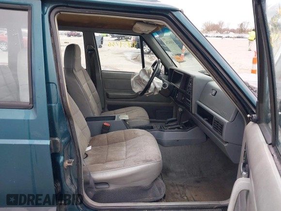 1996 Jeep Cherokee Sport with VIN 1J4FJ68S5TL235507, listed as a IAAI auction lot 41834736 with 174,634 mi miles. Bid and sale history available at carsss.com. Image 5.