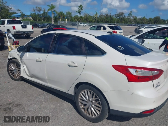 2012 Ford Focus SEL with VIN 1FAHP3H25CL282490, listed as a IAAI auction lot 40563360 with 223,864 mi miles. Bid and sale history available at carsss.com. Image 3.