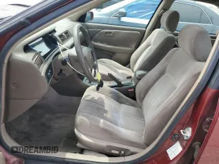 1999 Toyota Camry LE z VIN JT2BF22K8X0181675, wystawiony jako Copart lot #55057875 z przebiegiem 184 657 mil mil oraz Szkoda całkowita • Salvage title. Historia ofert i sprzedaży dostępna na DreamBid. Obrazek 7.
