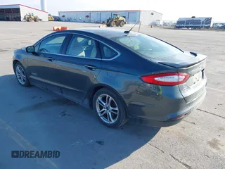 2016 Ford Fusion Titanium Hybrid with VIN 3FA6P0RU6GR156622, listed as a IAAI auction lot 41178887 with 92,423 mi miles. Bid and sale history available at carsss.com. Image 3.