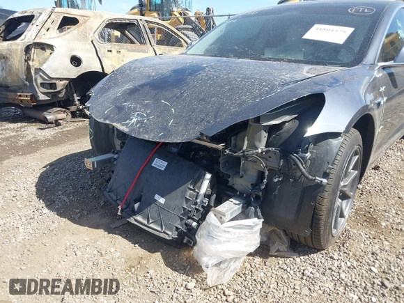 2019 Tesla Model 3 Mid Range with VIN 5YJ3E1EA5KF327679, listed as a IAAI auction lot 41804379 with 87,208 mi miles and . Bid and sale history available at DreamBid. Image 6.