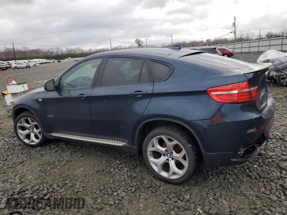 2013 BMW X6 xDrive35i z VIN 5UXFG2C55DL788611, wystawiony jako Copart lot #50972395 z przebiegiem 131 755 mil mil oraz Szkoda całkowita • Salvage title. Historia ofert i sprzedaży dostępna na DreamBid. Obrazek 2.
