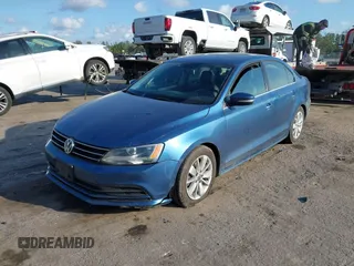 2016 Volkswagen Jetta Sedan 1.4T SE with VIN 3VWD67AJ0GM328412, listed as a IAAI auction lot 41556254 with 137,814 mi miles. Bid and sale history available at carsss.com. Image 17.