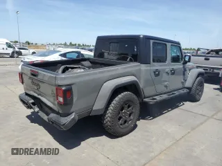 2023 Jeep Gladiator Sport S с VIN 1C6HJTAG3PL552959, выставлен на аукционе Copart как лот 56905635 с пробегом 30 356 миль миль и Списание • Salvage title. История ставок и продаж доступна на DreamBid. Изображение 3.