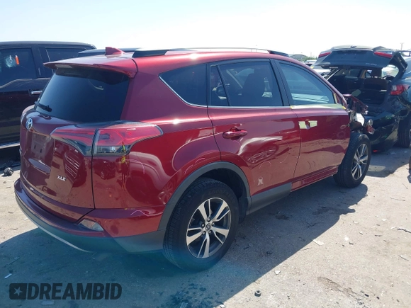 2018 Toyota RAV4 XLE with VIN 2T3WFREV8JW425464, listed as a IAAI auction lot 41977877 with 142,265 mi miles and . Bid and sale history available at carsss.com. Image 4.