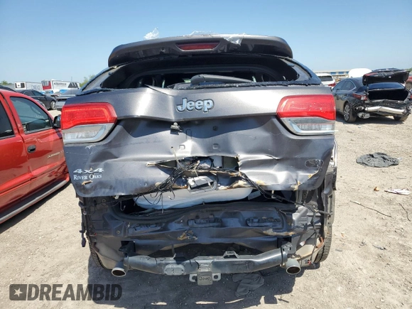 2017 Jeep Grand Cherokee Overland with VIN 1C4RJFCGXHC941983, listed as a Copart auction lot 52008825 with 65,776 mi miles and Salvage Title. Bid and sale history available at carsss.com. Image 6.