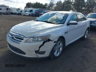2014 Ford Taurus SEL with VIN 1FAHP2E88EG127074, listed as a IAAI auction lot 41688975 with 186,650 mi miles. Bid and sale history available at carsss.com. Image 2.