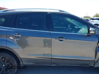 2017 Ford Escape Titanium with VIN 1FMCU0J97HUE07747, listed as a IAAI auction lot 41977788 with 104,560 mi miles. Bid and sale history available at carsss.com. Image 13.