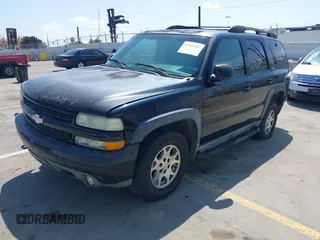 2001 Chevrolet Tahoe LT with VIN 1GNEK13T41R197657, listed as a IAAI auction lot 42164367 with 200,507 mi miles. Bid and sale history available at carsss.com. Image 2.