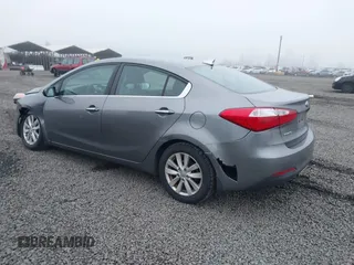 2014 Kia Forte EX with VIN KNAFX4A8XE5213014, listed as a IAAI auction lot 41000589 with 89,890 mi miles. Bid and sale history available at carsss.com. Image 3.