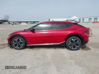 2022 Kia EV6 Wind z VIN KNDC3DLC6N5089018, wystawiony jako IAAI lot #41748175 z przebiegiem 25 157 mil mil oraz . Historia ofert i sprzedaży dostępna na DreamBid. Obrazek 14.