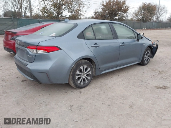 2021 Toyota Corolla Hybrid LE with VIN JTDEAMDE8MJ002711, listed as a IAAI auction lot 41498716 with 98,559 mi miles. Bid and sale history available at carsss.com. Image 4.