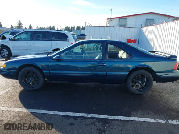 1996 Ford Thunderbird LX z VIN 1FALP62W1TH100925, wystawiony jako IAAI lot #41289811 z przebiegiem 84 056 mil mil oraz . Historia ofert i sprzedaży dostępna na DreamBid. Obrazek 14.
