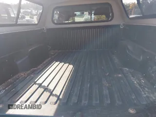 2012 Toyota Tacoma with VIN 5TFPX4ENXCX009676, listed as a IAAI auction lot 40458050 with 101,908 mi miles and . Bid and sale history available at DreamBid. Image 8.