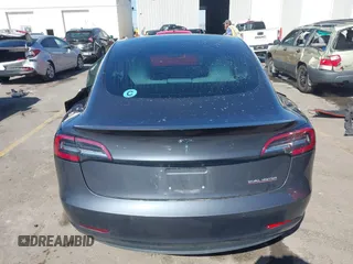 2018 Tesla Model 3 Long Range Battery with VIN 5YJ3E1EBXJF055203, listed as a IAAI auction lot 42019770 with 57,379 mi miles and . Bid and sale history available at DreamBid. Image 16.